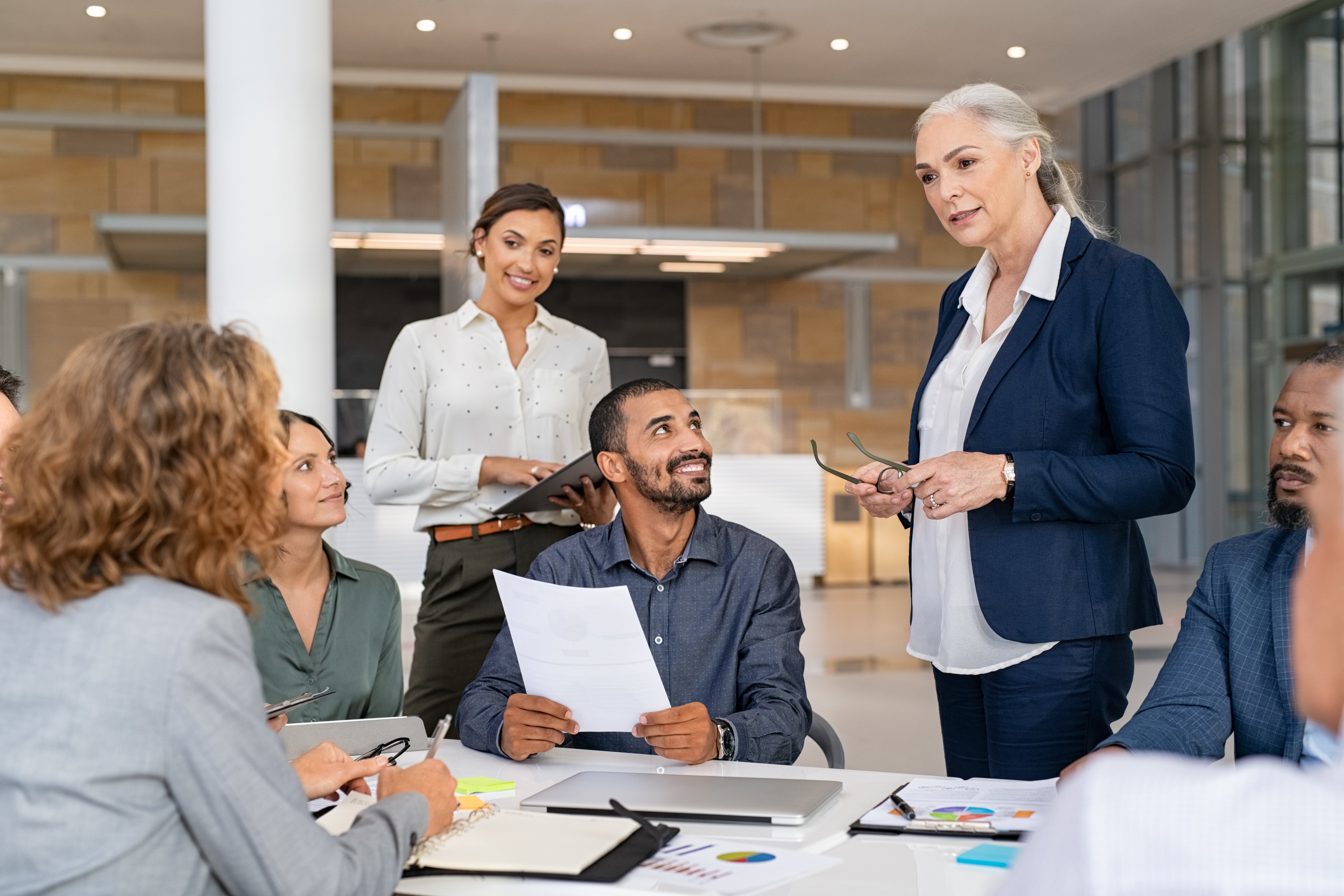 Female executive listening to her younger team in office 