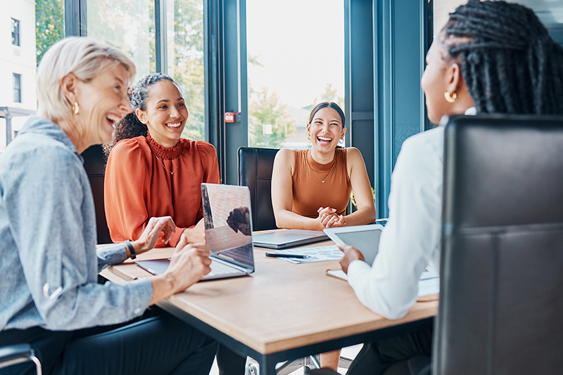 Women working together around table